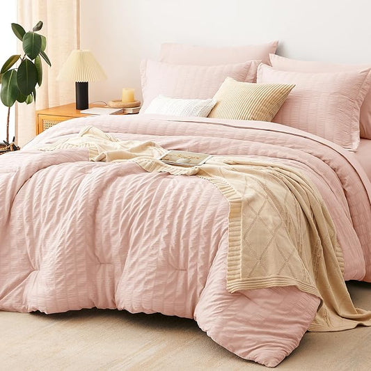 CozyLux Oversized King Comforter Set Blush Pink Seersucker 7 Pieces 120x98 Bed in a Bag Comforter Set with Sheets, Luxury Soft Bedding Sets with Down Alternative Comforter, Sheets, Pillowcases & Shams